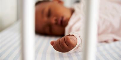 Infant in safe sleep position