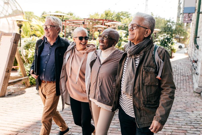 four older adults walking four older adults walking