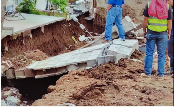 The collapsed portion of the wall.