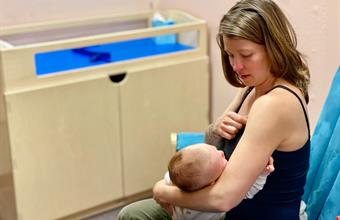 Mom breastfeeding during WIC counseling appointment